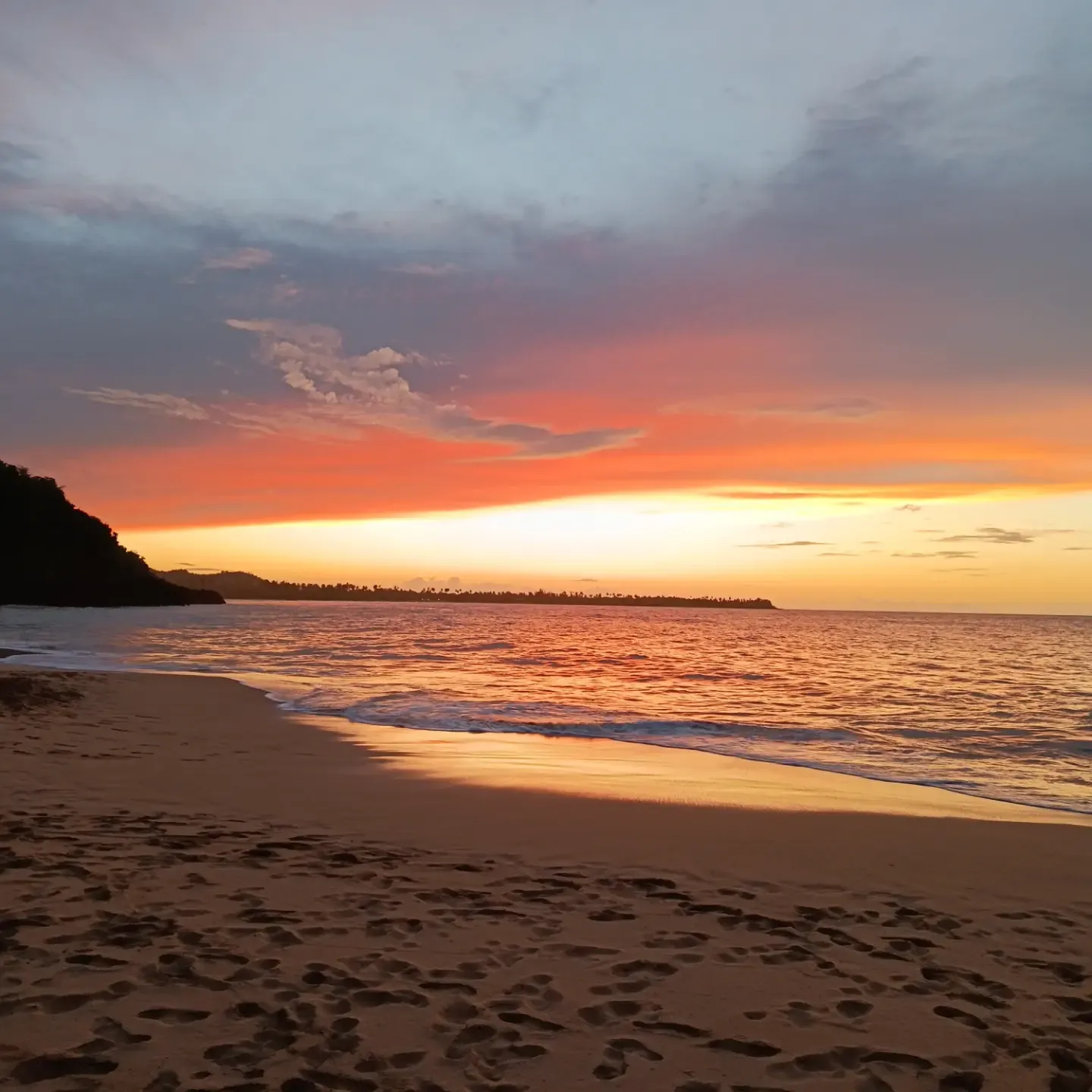 Orange sunset over the beach in Samaná
